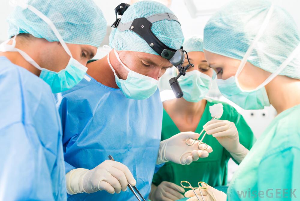 blue-scrubbed-surgeon-with-three-others