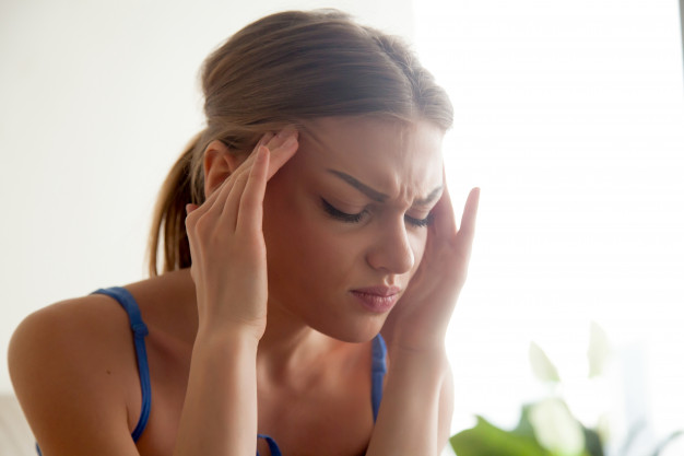 strong-headache-concept-young-woman-massaging-temples-suffering